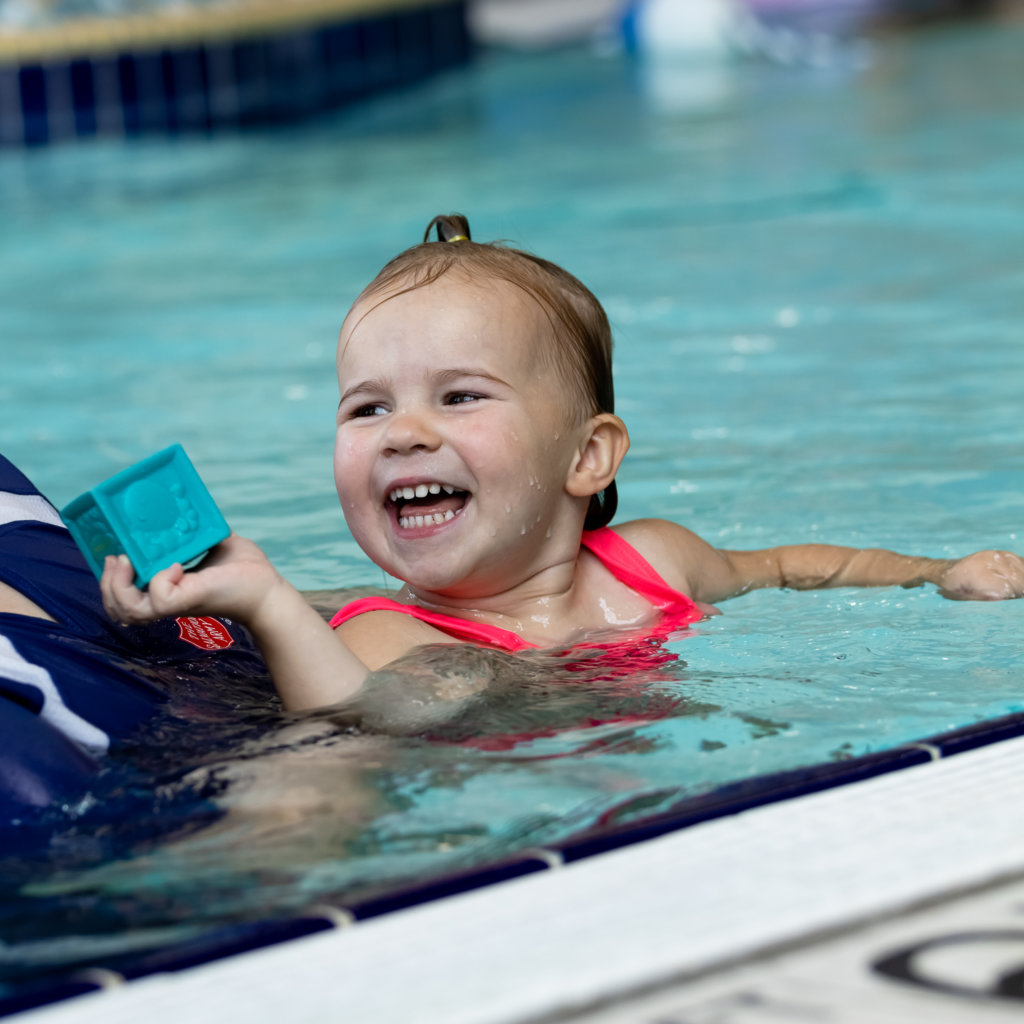 A Happy Young Girl in a Pool | Aquatics | The Salvation Army Kroc Center