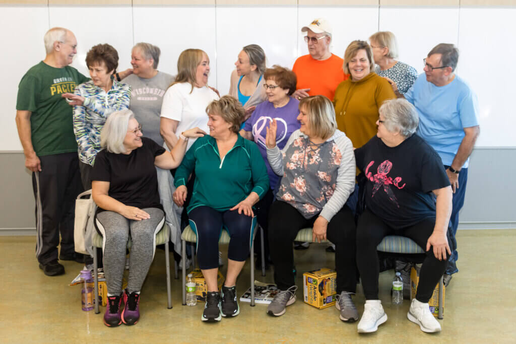 A Group of Senior Citizens Laughing and Smiling | Senior Programs | The Kroc Center