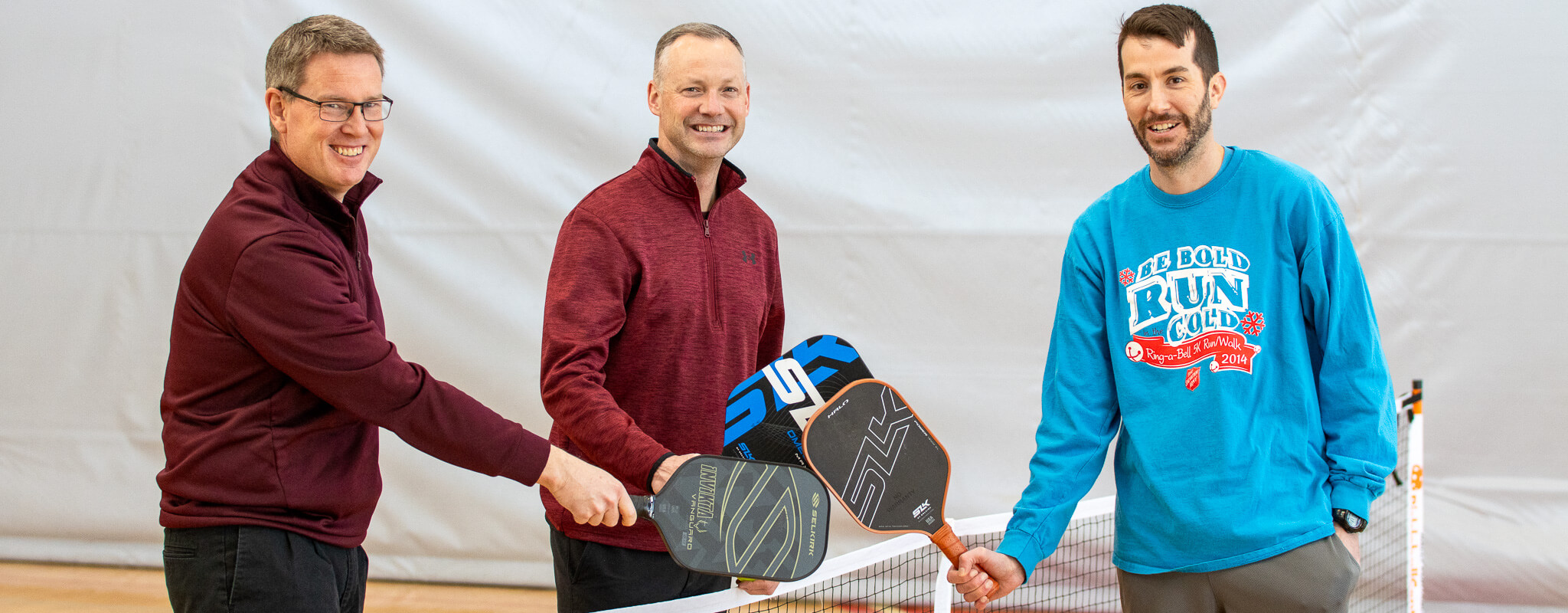 Adult men playing pickleball leagues indoors. Kroc Quincy, IL Sports Leagues